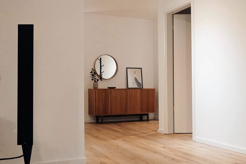 black tower speaker beside white wall